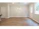 Bright dining room with hardwood floors and chandelier at 691 Sunstone Ln, Lawrenceville, GA 30043