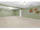 Spacious finished basement with neutral walls and carpeted floors at 775 N Ola N Rd, Mcdonough, GA 30252