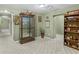 Finished basement hallway with display case and shelving at 775 N Ola N Rd, Mcdonough, GA 30252