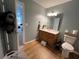 Clean bathroom with wood cabinets and a large mirror at 705 Jay St, Canton, GA 30115