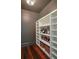 Well-stocked wine cellar with ample shelving for bottles and glasses at 3403 Tuxedo Nw Rd, Atlanta, GA 30305