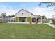 White community barn with open green doors and seating at 4004 Moody Ln, Woodstock, GA 30188