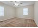 Well-lit bedroom with neutral carpeting and ceiling fan at 640 Steve Sw Dr, Atlanta, GA 30315