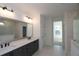 Modern bathroom with double vanity and large mirror at 2340 Ellis Mountain Dr, Marietta, GA 30064