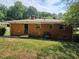 Back exterior of brick home with yard at 3436 Adkins Rd, Atlanta, GA 30331