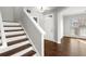 Hardwood floor entryway with staircase and front door at 4618 Liberty Square Dr, Acworth, GA 30101