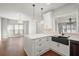 Modern kitchen with white cabinets, quartz countertops and island at 4618 Liberty Square Dr, Acworth, GA 30101