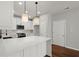 Modern kitchen with white cabinets, quartz countertops, and a large island at 4618 Liberty Square Dr, Acworth, GA 30101