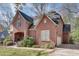 Brick house with two-car garage and manicured lawn at 1376 Oak Grove Dr, Decatur, GA 30033