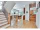 Elegant staircase with hardwood treads and a metal railing at 1376 Oak Grove Dr, Decatur, GA 30033