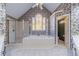 Bathroom with garden tub, shower, and stained glass window at 2590 Hidden Wood Ln, Lawrenceville, GA 30043