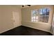 Bright bonus room with dark hardwood floors, an exterior door, and a window seat at 265 Line Sw Rd, Atlanta, GA 30331