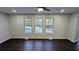 Living room with hardwood floors and multiple windows at 265 Line Sw Rd, Atlanta, GA 30331