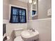 Clean bathroom with white tile and updated vanity at 1374 Margarette Dr, Decatur, GA 30035