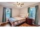 Spacious bedroom with hardwood floors and two windows at 1374 Margarette Dr, Decatur, GA 30035