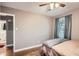 Cozy bedroom with hardwood floors and ceiling fan at 1374 Margarette Dr, Decatur, GA 30035