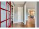 Bright and airy entryway with hardwood floors and red door at 1374 Margarette Dr, Decatur, GA 30035