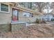Front entrance with a red door and wrought iron railing at 1374 Margarette Dr, Decatur, GA 30035