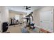 Well-equipped home gym featuring various exercise machines at 4079 Bullock Bridge Rd, Loganville, GA 30052