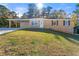 Brick ranch home with carport and landscaped yard at 3765 Cindy Dr, Douglasville, GA 30135