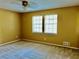 Bright bedroom with neutral walls, carpet, and two windows at 997 Chartley Sw Dr, Lilburn, GA 30047