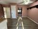 View of kitchen and dining area with wood-look floors at 997 Chartley Sw Dr, Lilburn, GA 30047