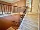 View from above of carpeted staircase with metal railing at 997 Chartley Sw Dr, Lilburn, GA 30047