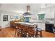 Spacious kitchen with island seating and white cabinetry at 2251 Whetstone Dr, Grayson, GA 30017