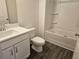 Main bathroom with a shower/tub combo and white vanity at 2484 Honey Way, Conyers, GA 30013