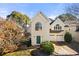 Two-story house with a yellow facade and a two-car garage at 2829 Ashwood Pl, Decatur, GA 30030