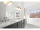 Elegant bathroom with double vanity, marble countertop, and a large soaking tub at 2829 Ashwood Pl, Decatur, GA 30030