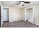 Spacious bedroom with ceiling fan, carpet, and ample closet space at 4404 Mercer Rd, Decatur, GA 30035