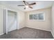 Bedroom with ceiling fan, neutral walls, and carpet flooring at 4404 Mercer Rd, Decatur, GA 30035