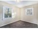 Well-lit bedroom with carpet and two windows at 4404 Mercer Rd, Decatur, GA 30035