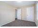 Bedroom with carpet flooring and access to bathroom and closet at 4404 Mercer Rd, Decatur, GA 30035