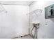 Unfinished laundry area with shelving and electrical panel at 4404 Mercer Rd, Decatur, GA 30035