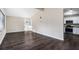 Open concept living room with kitchen access and vinyl flooring at 4404 Mercer Rd, Decatur, GA 30035