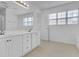 Bathroom with double sinks and white cabinets at 840 Minor Creek Nw Way, Lilburn, GA 30047