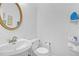 Clean and bright bathroom with a white sink and toilet at 840 Minor Creek Nw Way, Lilburn, GA 30047