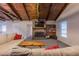 Living room with a cozy fireplace, built-in shelving, and a vaulted wood ceiling at 1175 Huey Rd, Douglasville, GA 30134