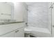 Modern bathroom with marble tile and bathtub at 8775 Lee Rd, Lithia Springs, GA 30122