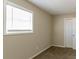 Charming bedroom with window, neutral walls and carpet at 8775 Lee Rd, Lithia Springs, GA 30122