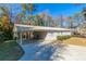 Ranch home with carport and mature trees at 8775 Lee Rd, Lithia Springs, GA 30122