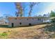 Ranch house with a partial basement, covered patio, and a spacious backyard at 8775 Lee Rd, Lithia Springs, GA 30122