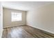 Bright living room with wood-look floors at 8775 Lee Rd, Lithia Springs, GA 30122