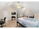 Spacious bedroom with vaulted ceilings, a large bed and room for a home office at 2741 Sedgeview Ne Ln, Buford, GA 30519
