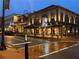 Two-story brick building at night with clock and lights at 2741 Sedgeview Ne Ln, Buford, GA 30519