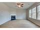 Bright living room features a corner fireplace and plenty of natural light at 412 Brekston Way, Mcdonough, GA 30253