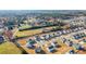 Aerial view of a new residential development with numerous houses at 1049 Bodega Loop, Locust Grove, GA 30248
