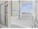 Modern bathroom with soaking tub, walk-in shower, and marble tile at 1049 Bodega Loop, Locust Grove, GA 30248